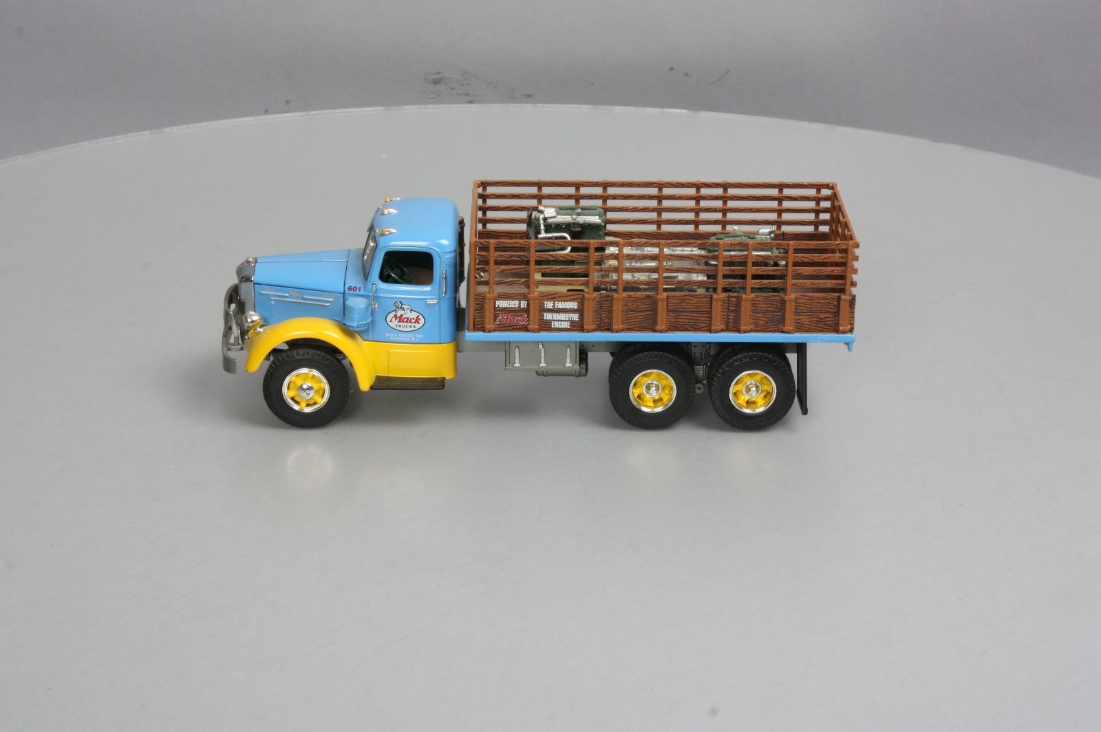 First Gear 19-3155 1:34 Scale Diecast Mack L Series Stake Truck with Engine Load