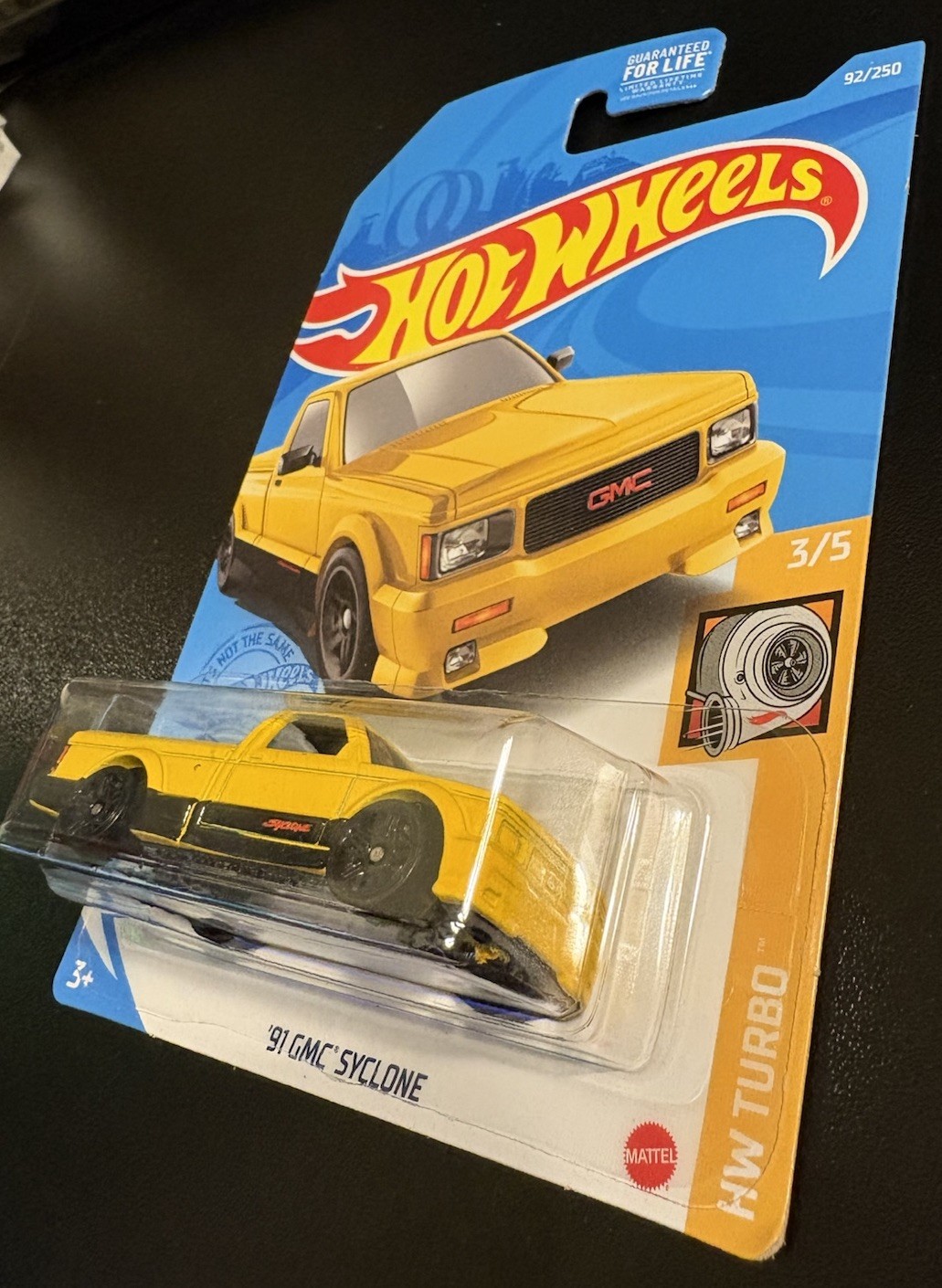 Hot Wheels Kroger 2021 Yellow ‘91 GMC Syclone in Protector HW Turbo 3/5 #92/250