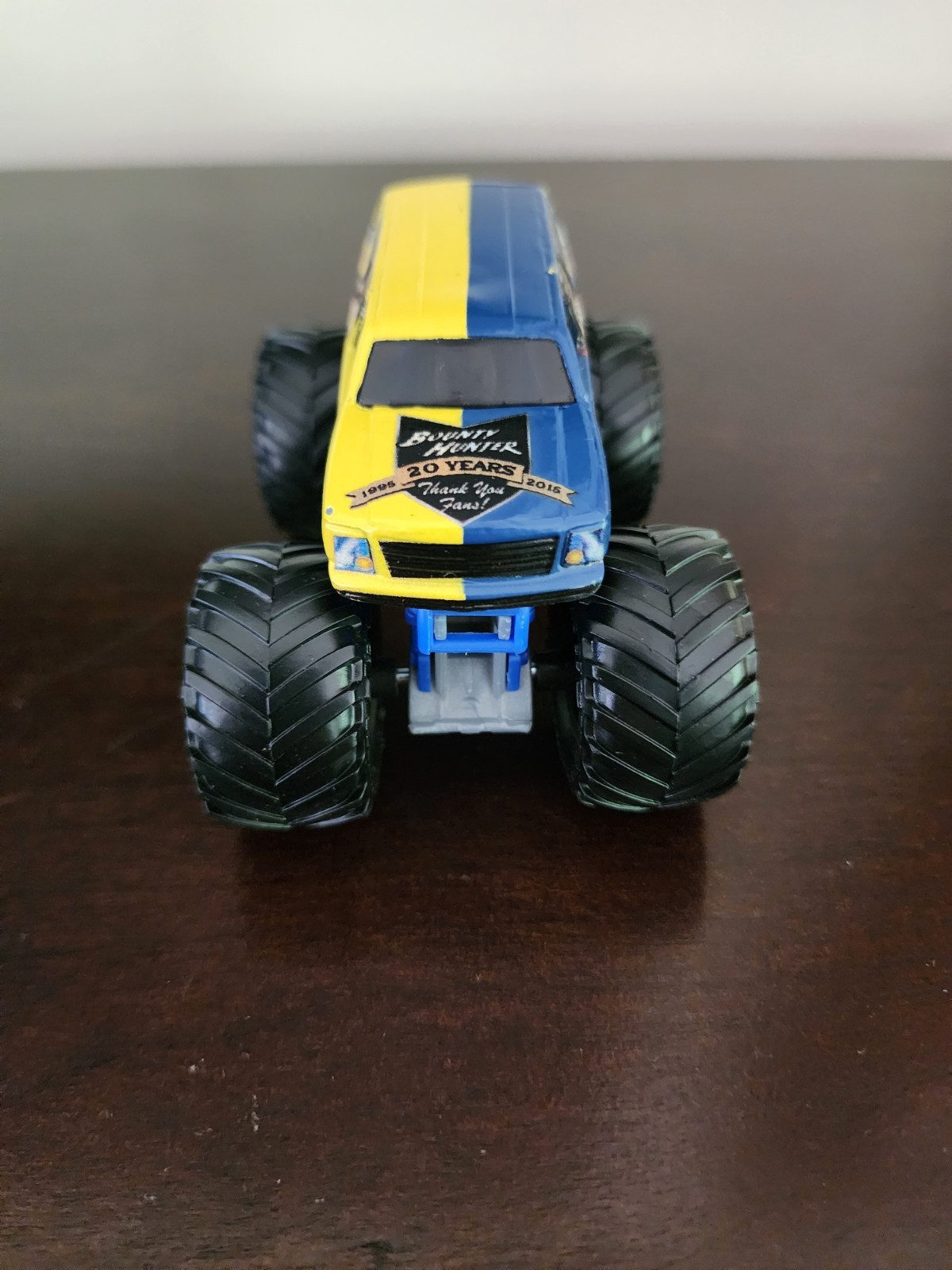 Bounty Hunter monster jam 1:64 diecast 20 years blue and yellow
