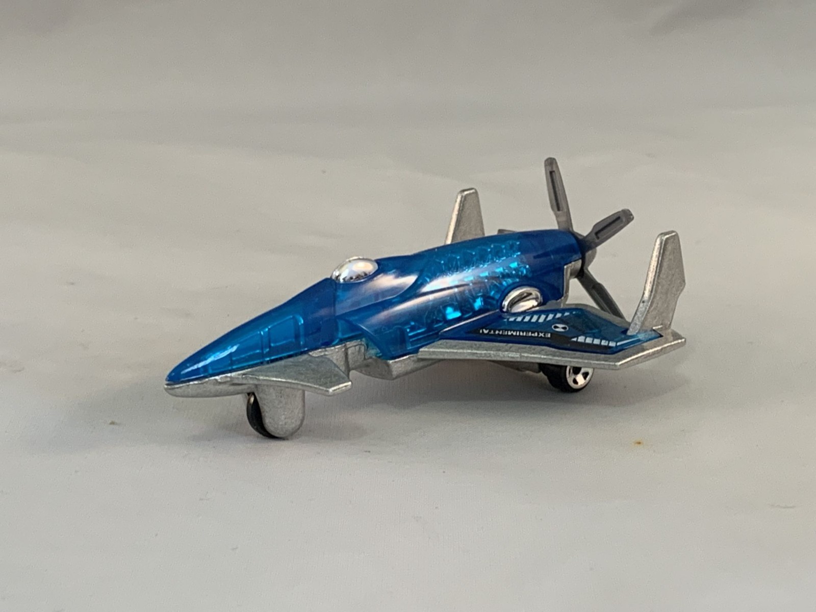 Hot Wheels Poison Arrow 2005 Kmart Clear Blue Micros