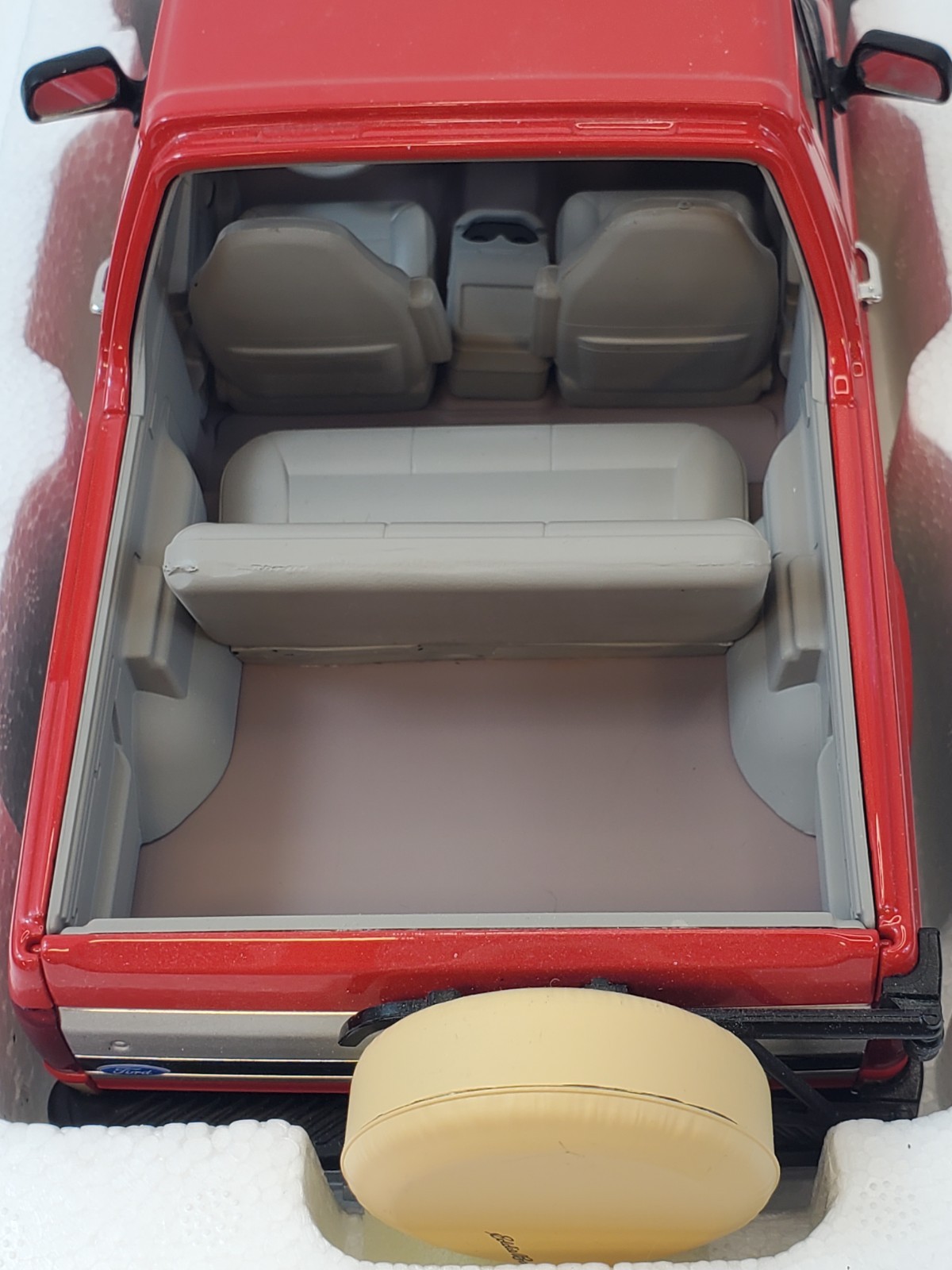 Greenlight 1994 Ford Bronco Eddie Bauer Edition Electric Red & Bronze 1/18