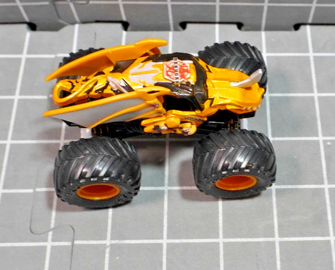 Lot of 4 Hot Wheels including Monster Jam Gears and Galaxies Pirates Curse 1/64