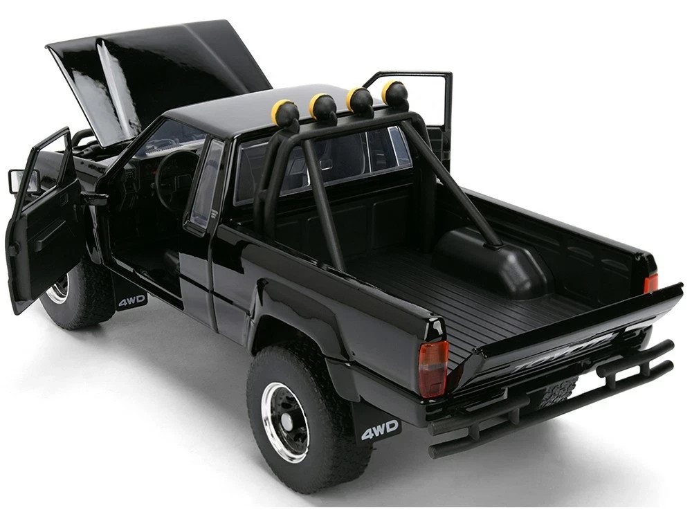 1985 TOYOTA SR5 PICKUP BLACK W/SKATEBOARD “BACK TO THE FUTURE” 1/24 JADA 36479
