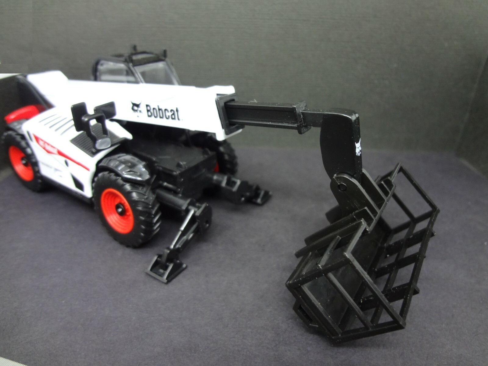 BOBCAT telescopic handler with man platform – Construction Warehouse