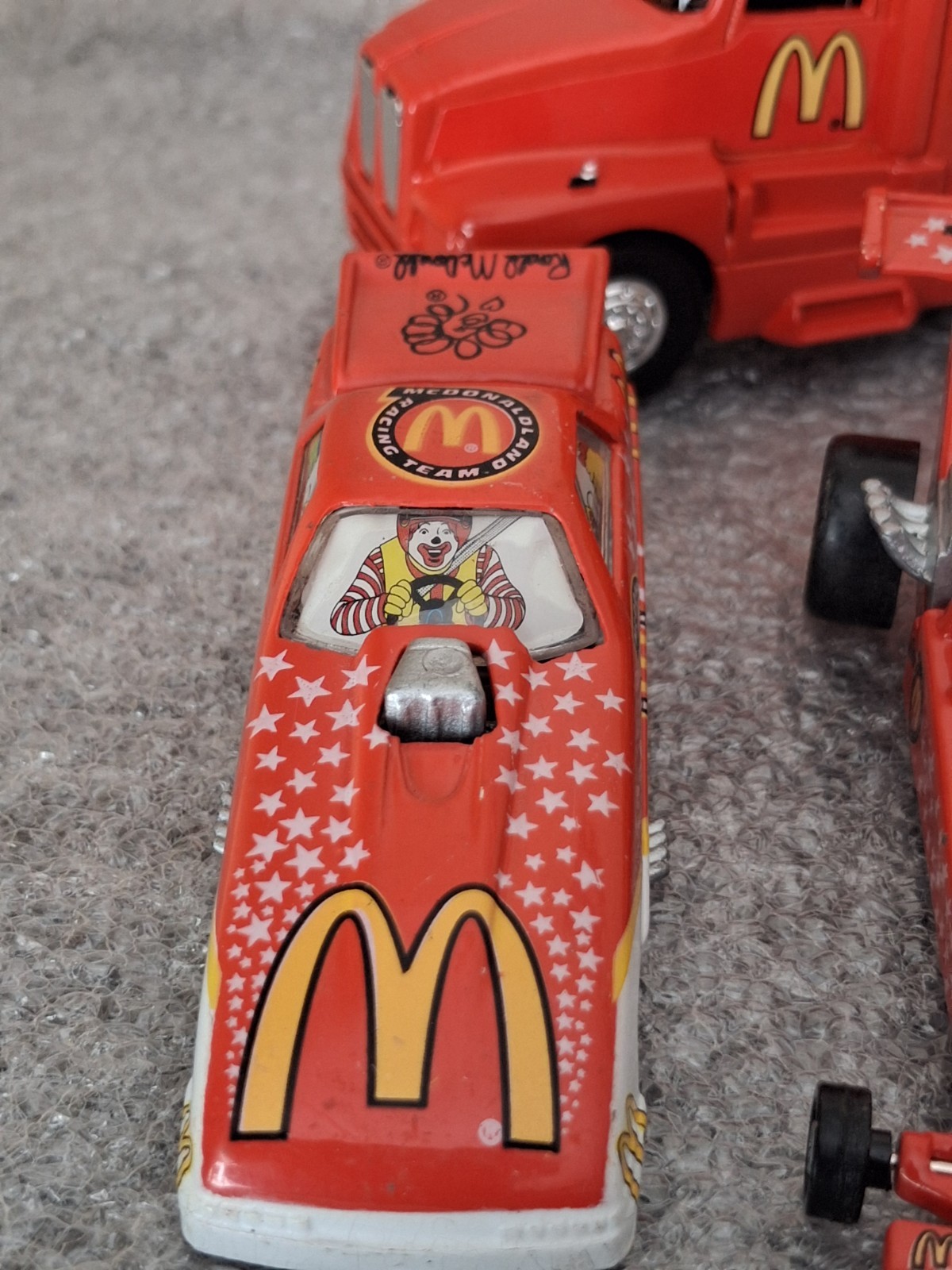 Lot of 1994 McDonaldland Transporter & 7 Car Racing Team set 1-64
