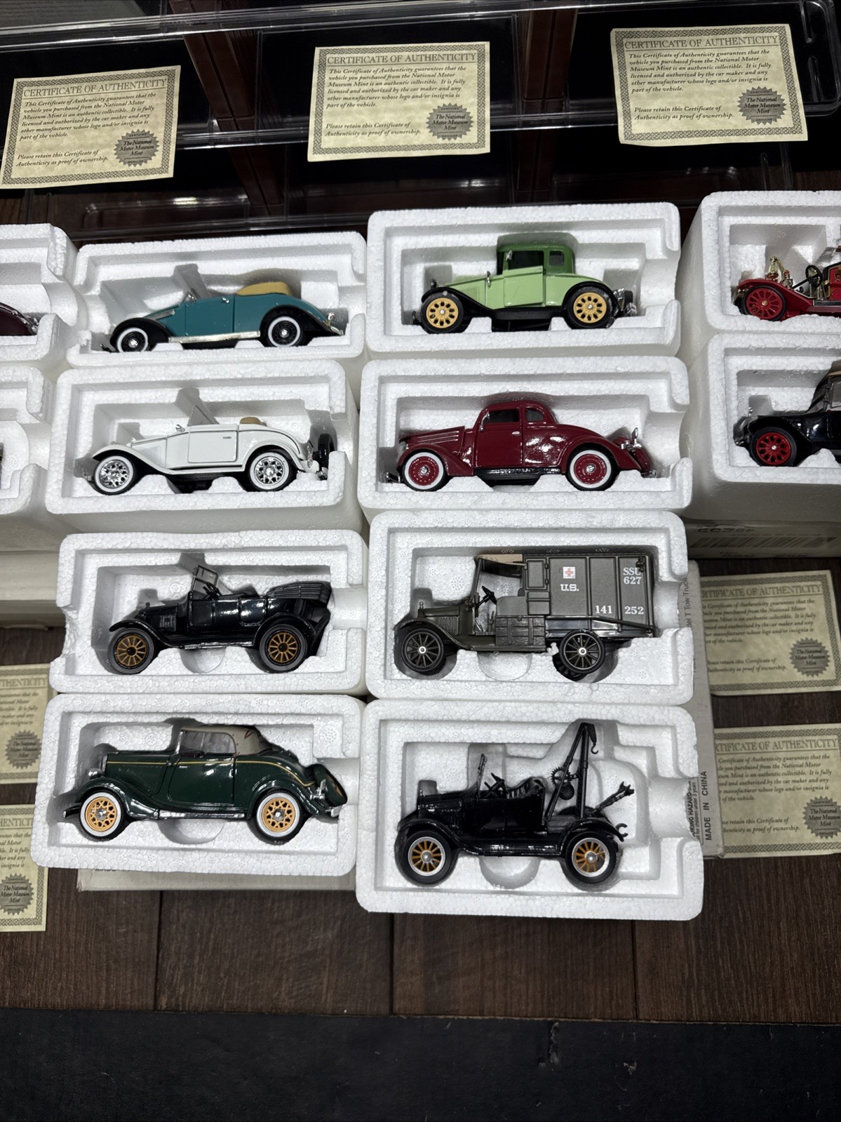 Lot Of 12 NATIONAL MOTOR MUSEUM MINT CARS WITH DISPLAY STAND