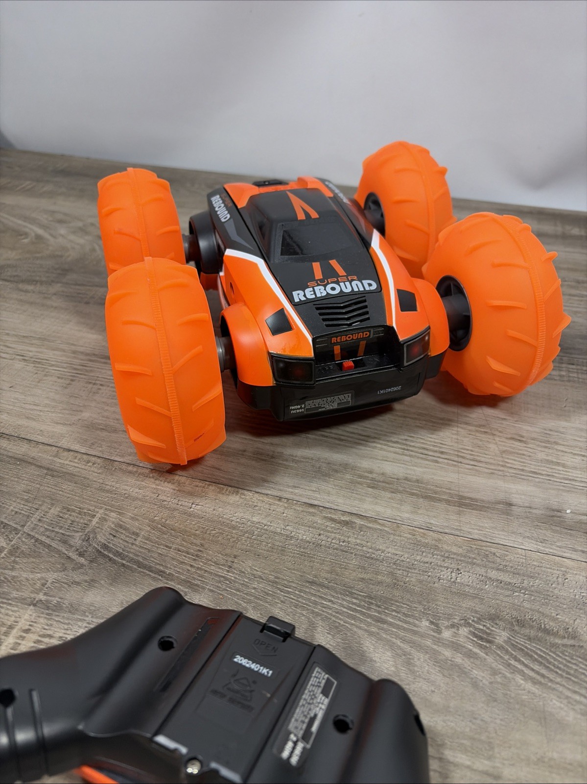 New Bright (1:16) Super Rebound Remote Control Orange Stunt Vehicle READ DESCR..