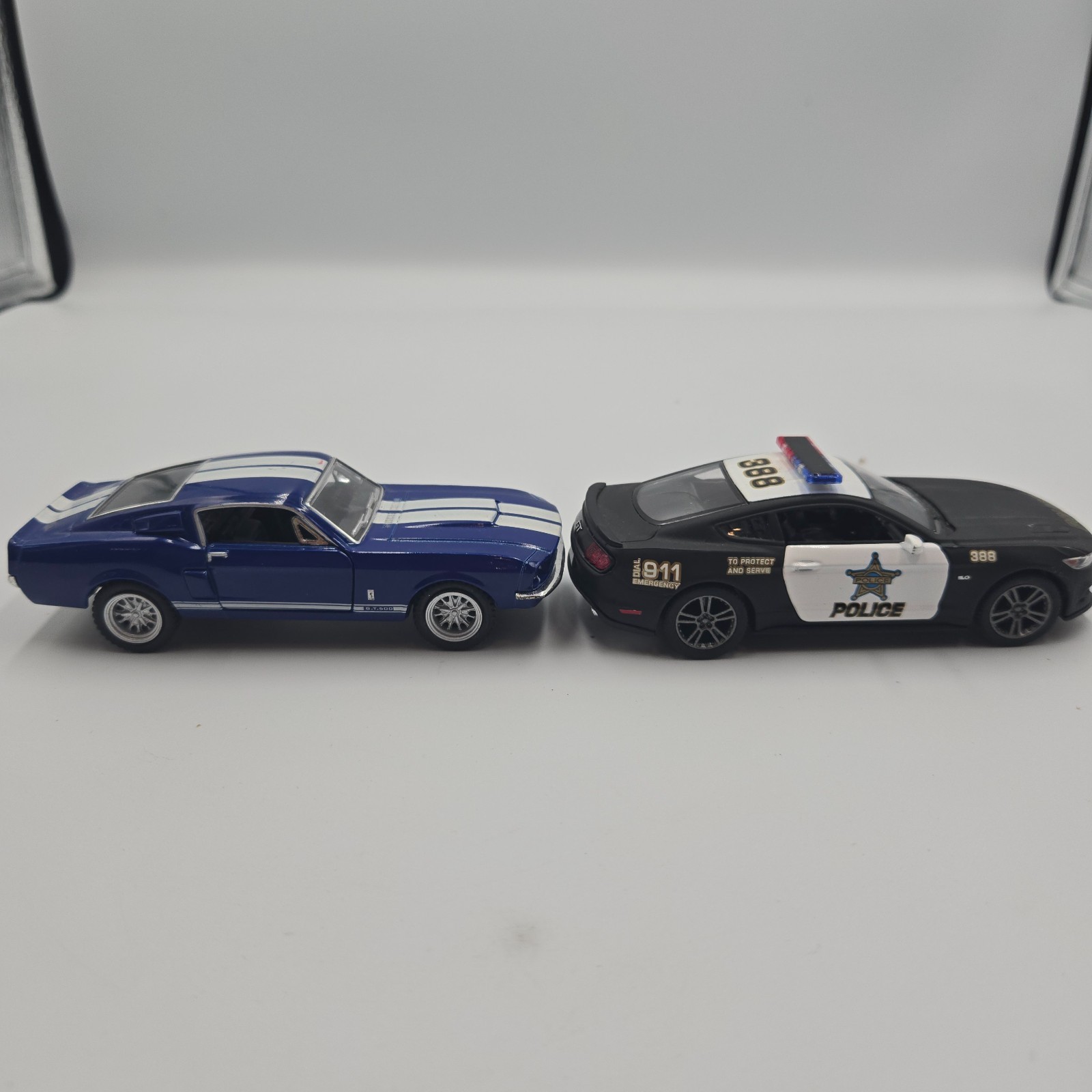 Lot of 3 – Kintoy model cars & Maisto Trailer