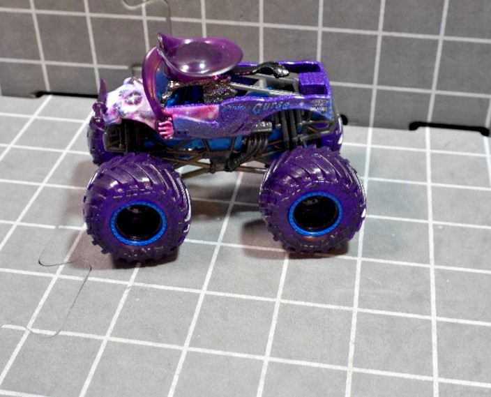 Lot of 4 Hot Wheels including Monster Jam Gears and Galaxies Pirates Curse 1/64