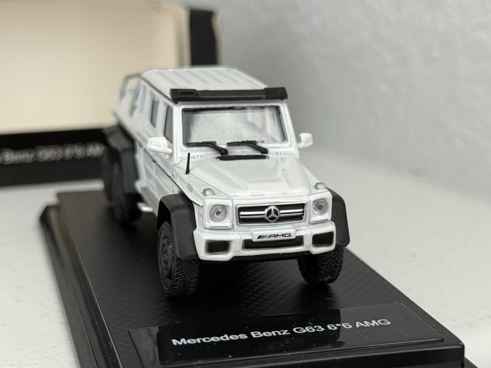 China 1:64 unbranded diecast Mercedes Benz G63 AMG 6×6 in white; premium model