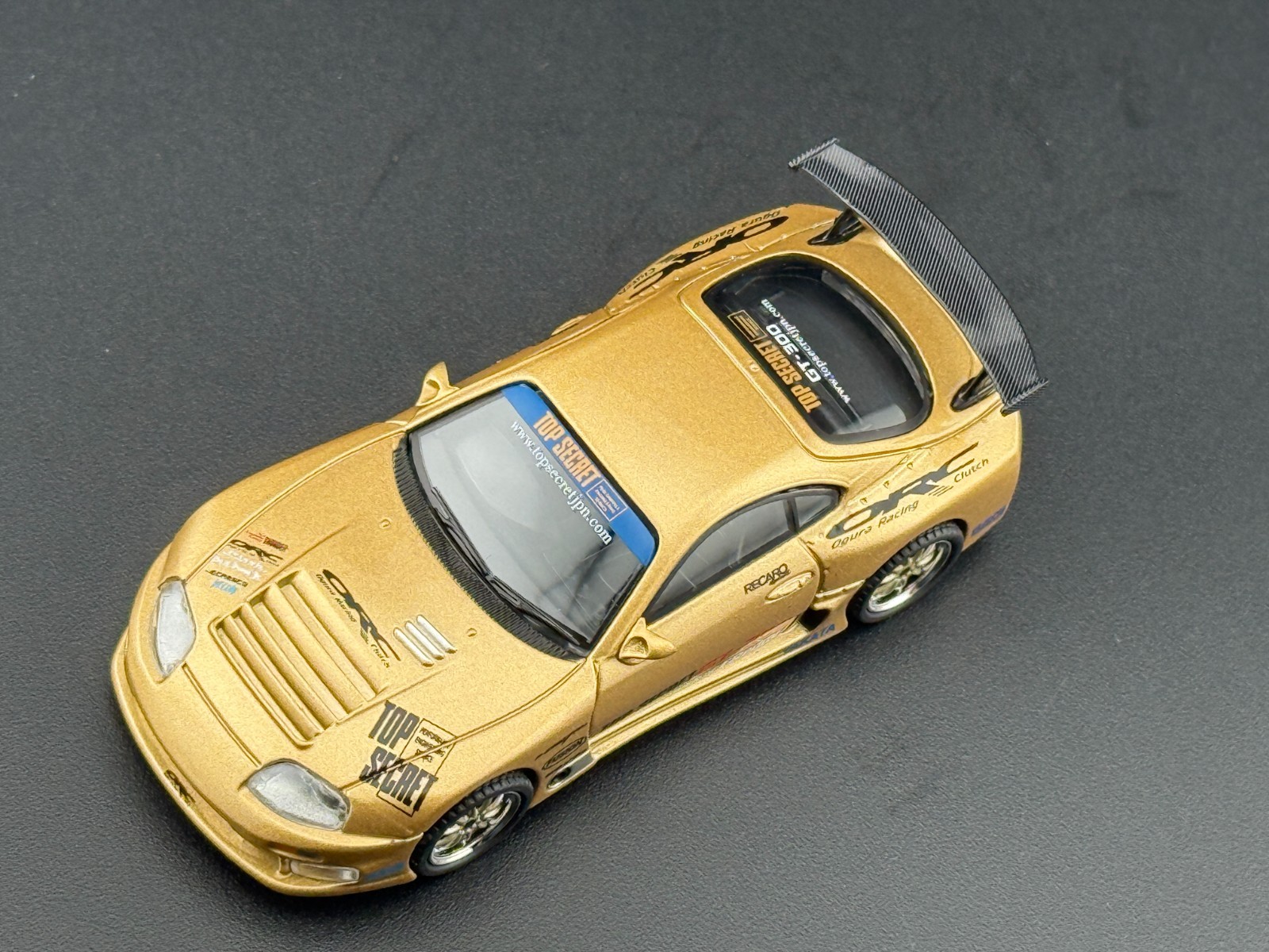 Mini GT Toyota Supra (A80) Top Secret GT-300 – Top Secret Gold #961 1/64