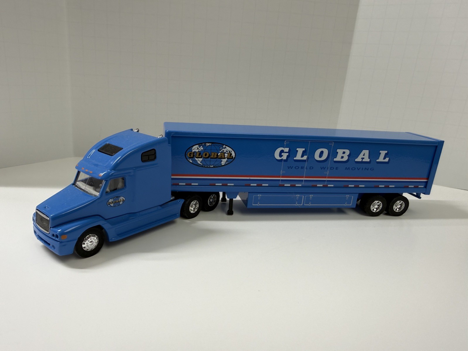 Global Van Lines 1:64 Diecast Tractor Trailer Semi Blue/White/Red. No box.