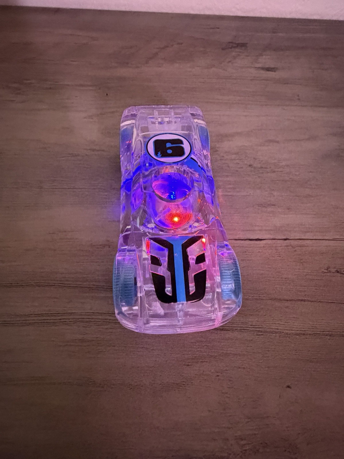 Clear Plastic Light-Up Toy Car with Blue Wheels, Ages 3+, Boys & Girls