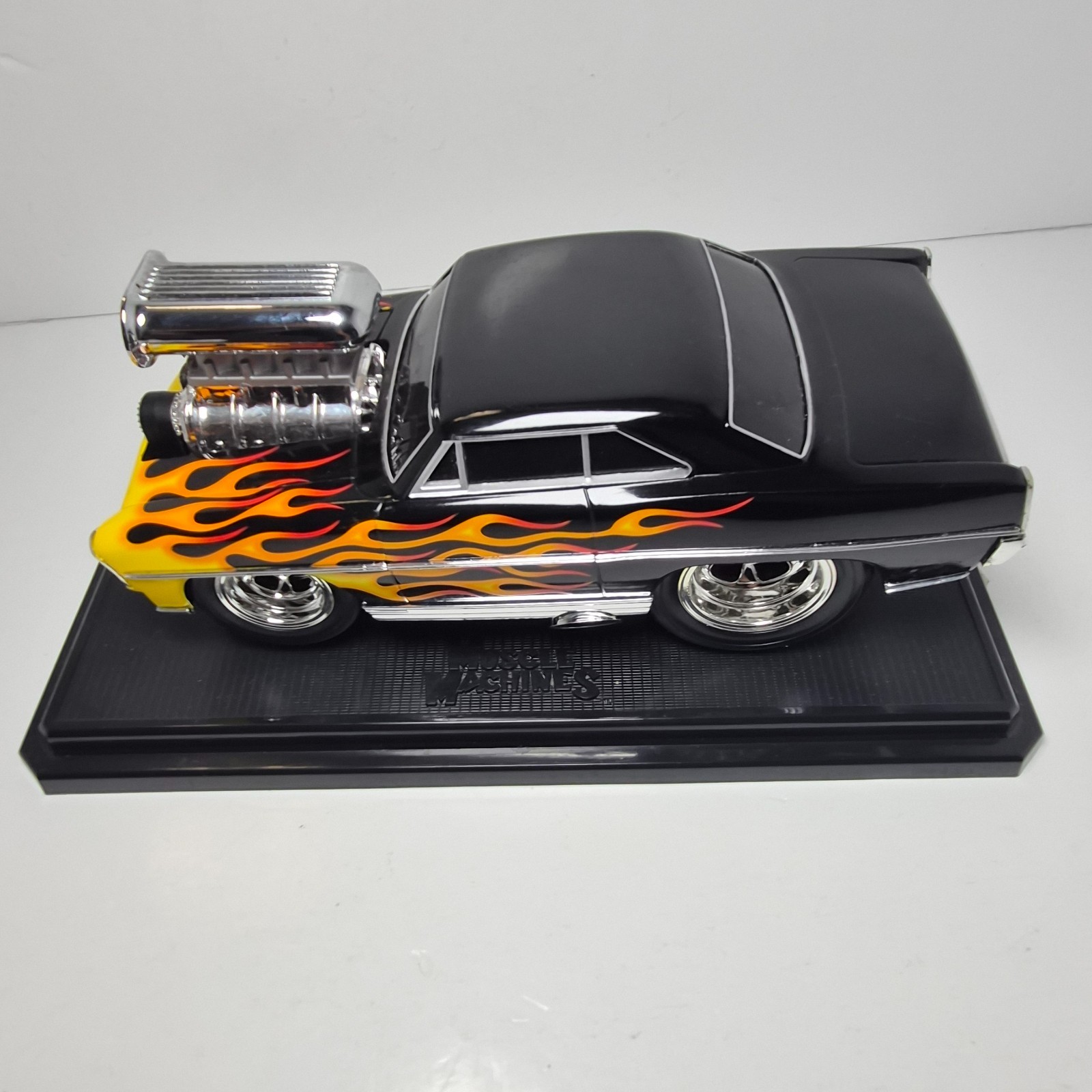 Muscle Machines 1967 Chevy Nova Black Flames 1:18 Diecast w/ Base