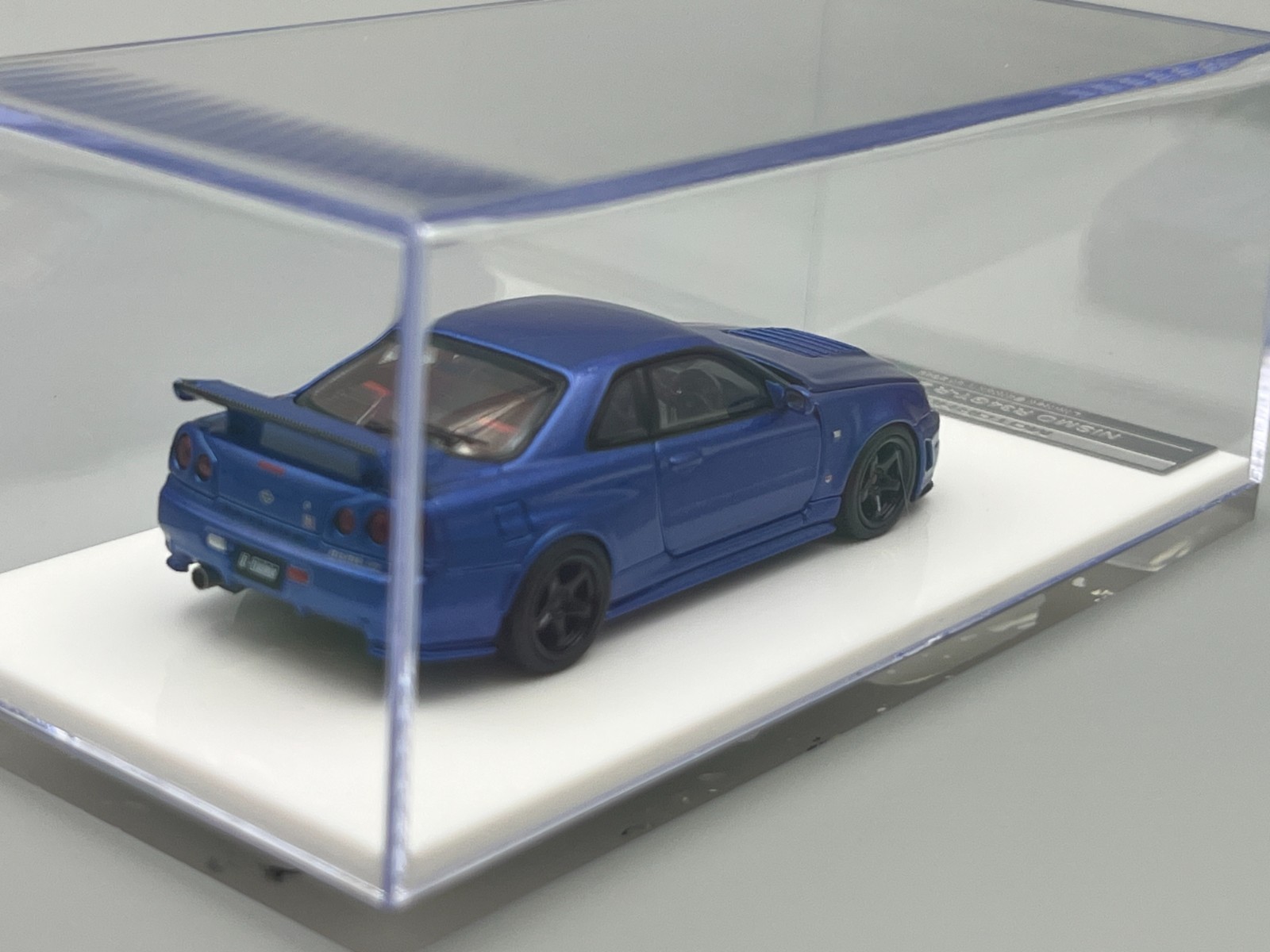 Nissan Skyline NISMO R34 GT-R Z-Tune Bayside Blue MotorHelix 1/64 scale display