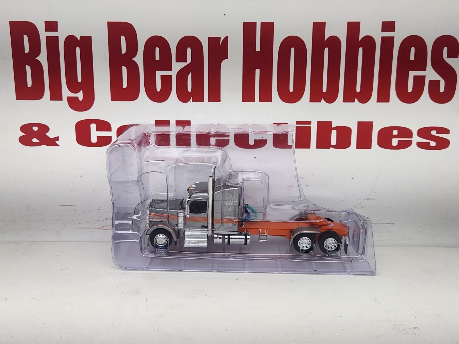 1/64 New DCP Orange & Silver 589 Peterbilt 58″ Mid Roof Sleeper Tractor