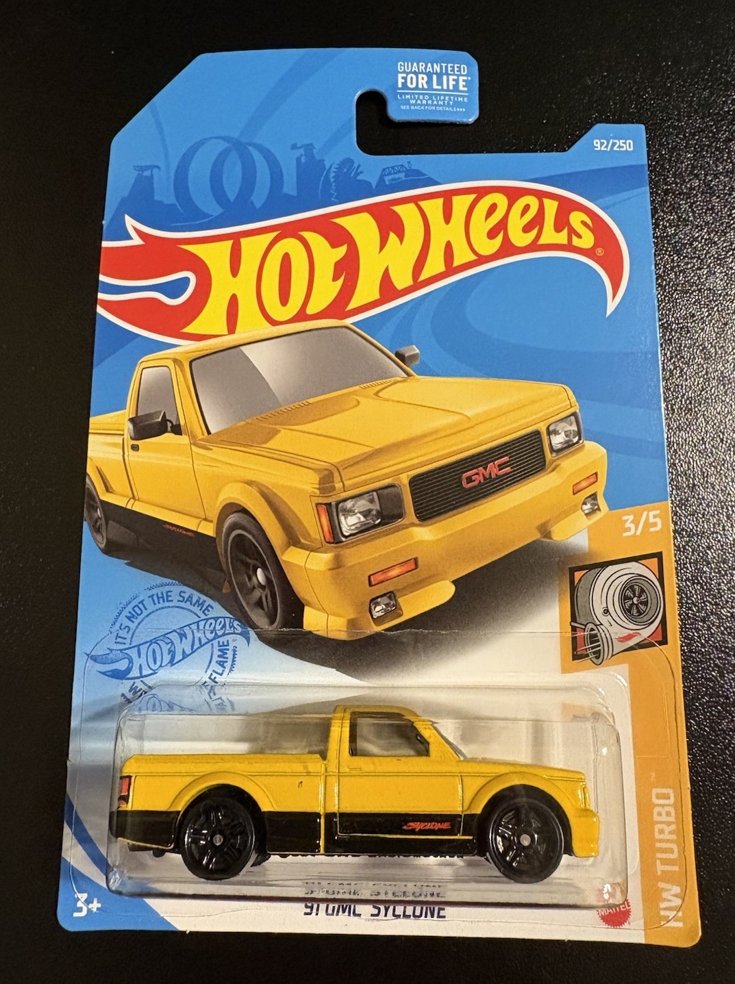 Hot Wheels Kroger 2021 Yellow ‘91 GMC Syclone in Protector HW Turbo 3/5 #92/250