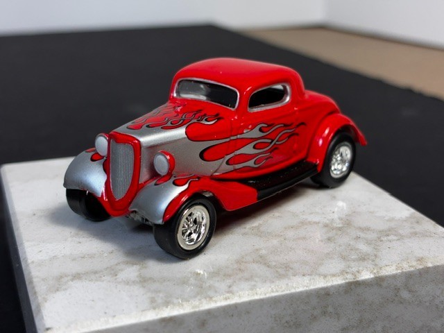 Johnny Lightning ’34 Ford Custom Coupe. 1:64 DIECAST. 2000. Red w/ Silver Flames