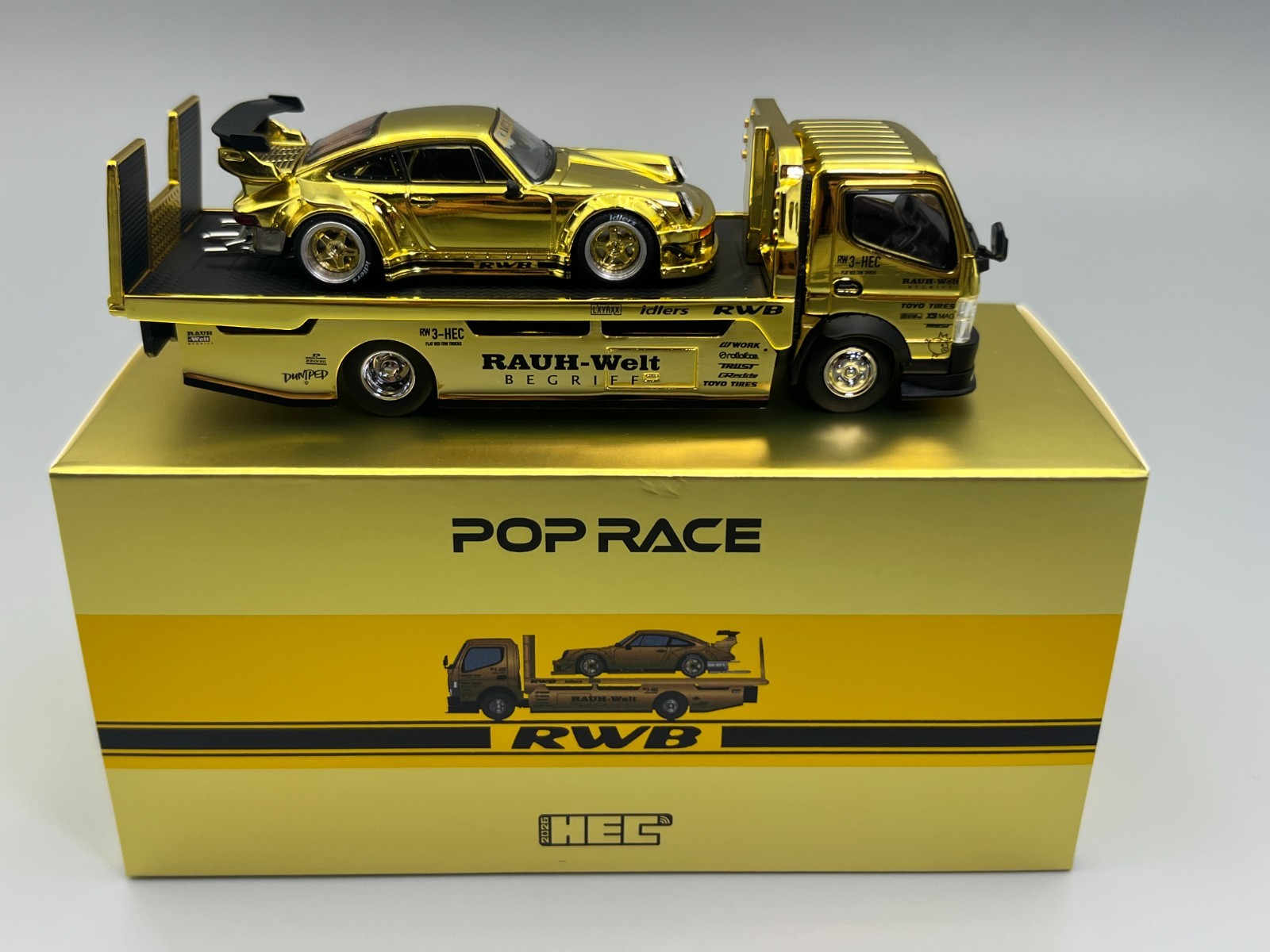 RWB 930 and Transporter Gold Porsche 911 HEC 2026 Exclusive Poprace 1/64 scale