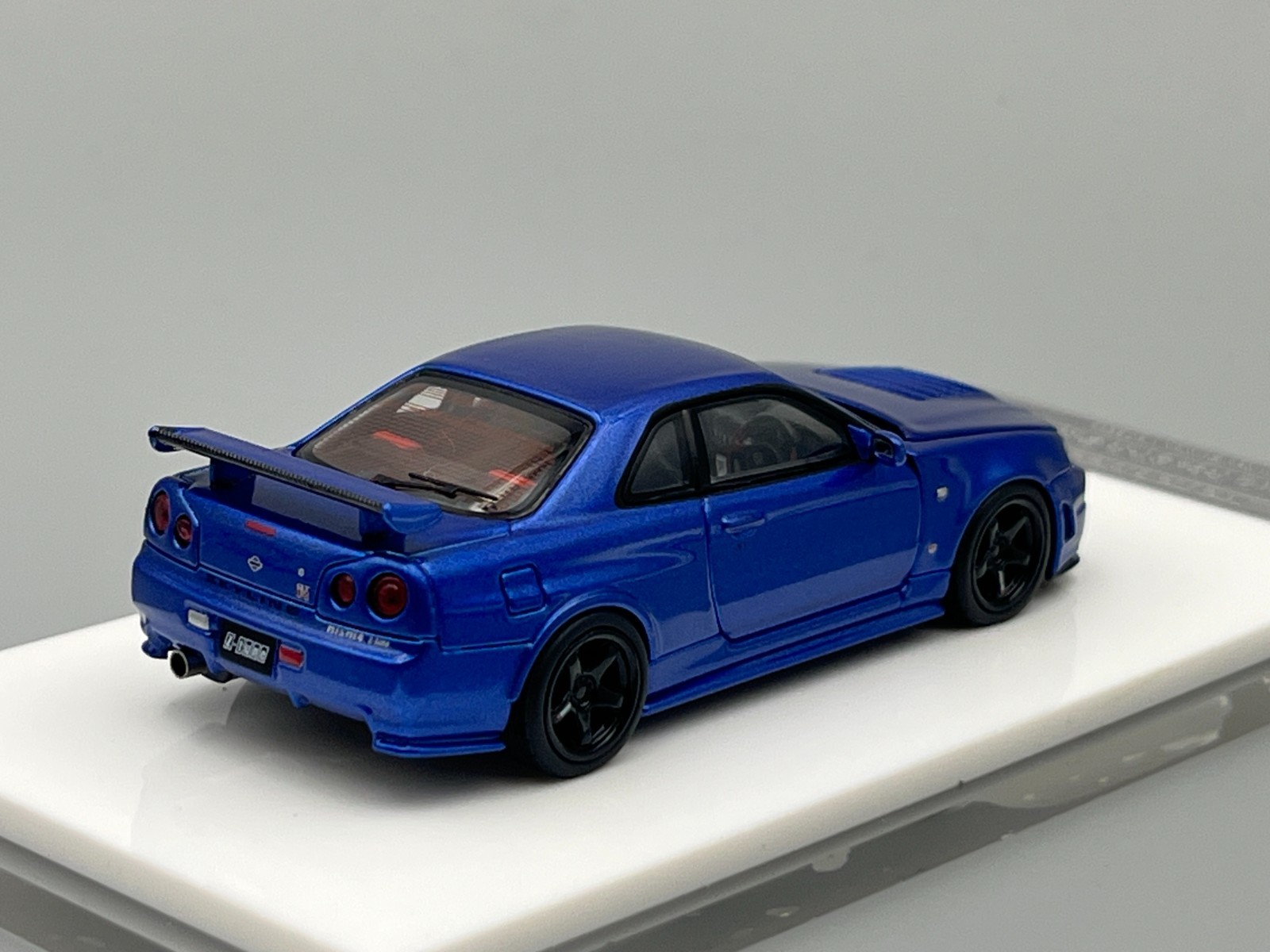 Nissan Skyline NISMO R34 GT-R Z-Tune Bayside Blue MotorHelix 1/64 scale display