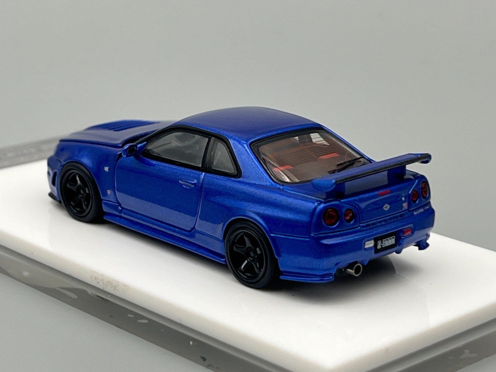 Nissan Skyline NISMO R34 GT-R Z-Tune Bayside Blue MotorHelix 1/64 scale display
