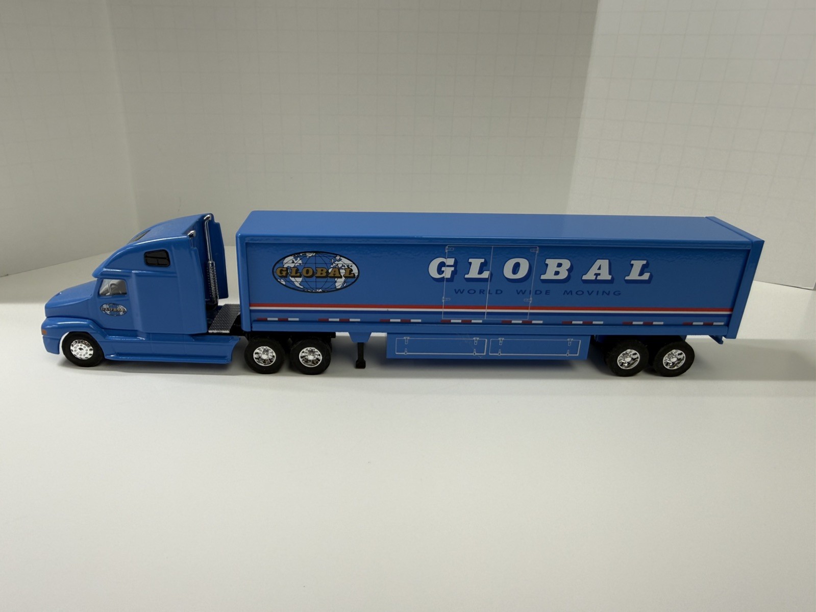 Global Van Lines 1:64 Diecast Tractor Trailer Semi Blue/White/Red. No box.