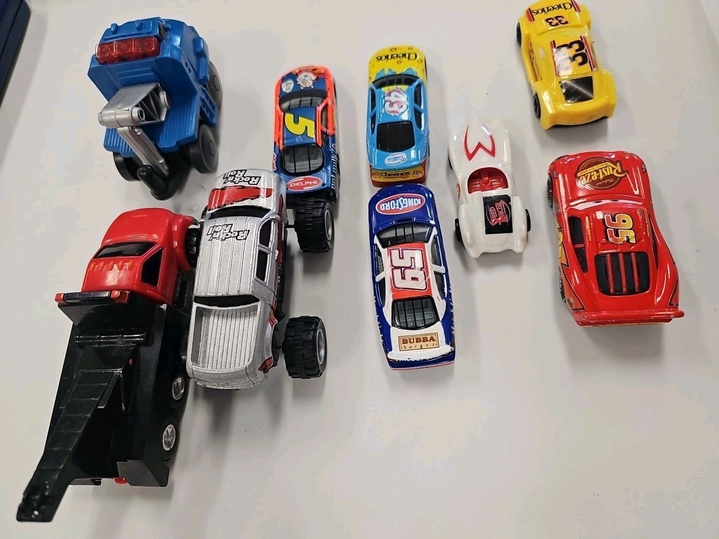 Lot Of 9 Assorted Die-Cast And Plastic Toy Cars Assorted manufacturing.