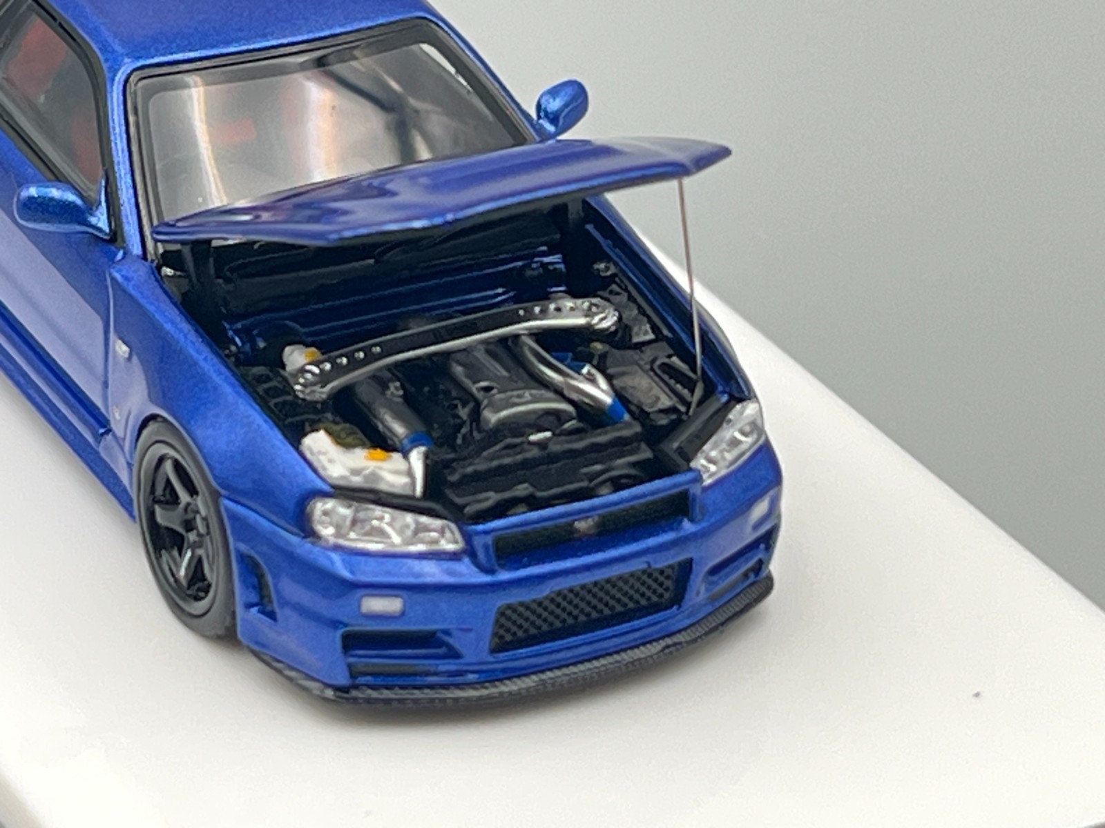 Nissan Skyline NISMO R34 GT-R Z-Tune Bayside Blue MotorHelix 1/64 scale display