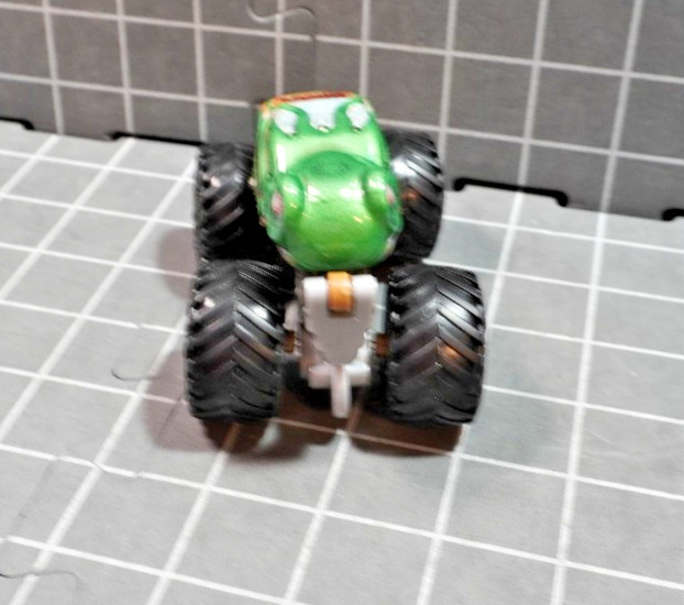 Lot of 4 Hot Wheels including Monster Jam Gears and Galaxies Pirates Curse 1/64