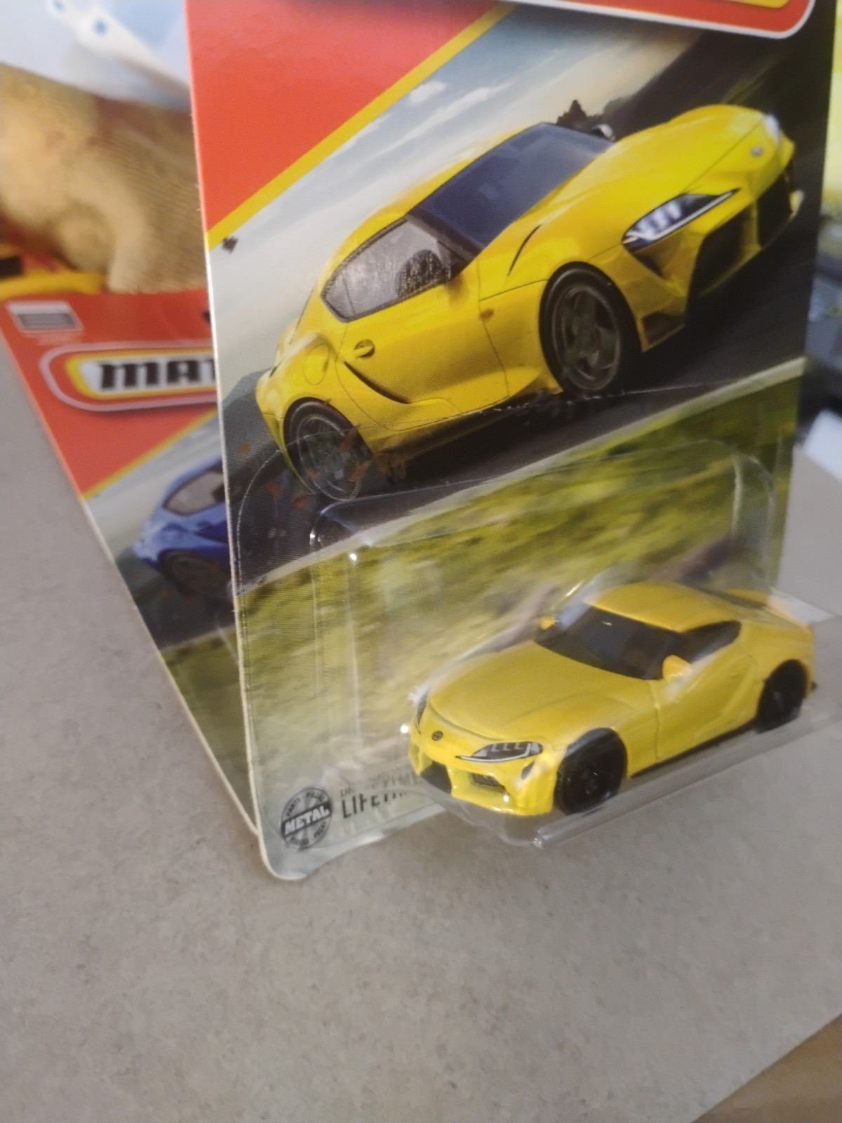 Blue And Yellow 2023 Toyota Gr Supra Matchbox 164 Scale