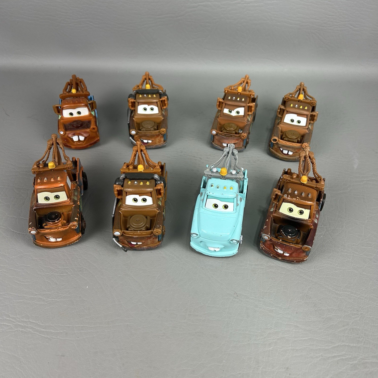 Disney Pixar Cars Diecast Tow Mater Lot of 8 One light blue Different Eyes
