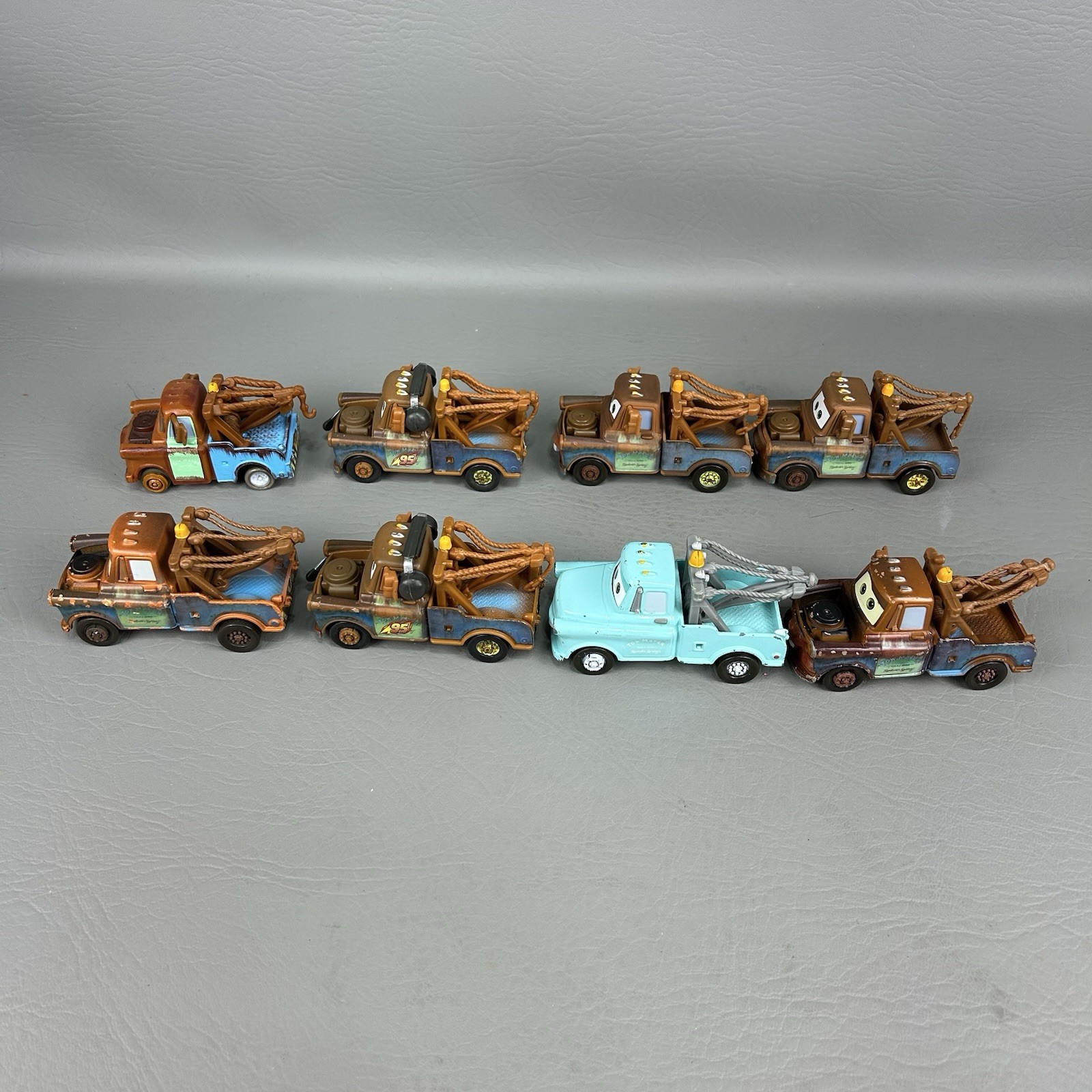 Disney Pixar Cars Diecast Tow Mater Lot of 8 One light blue Different Eyes