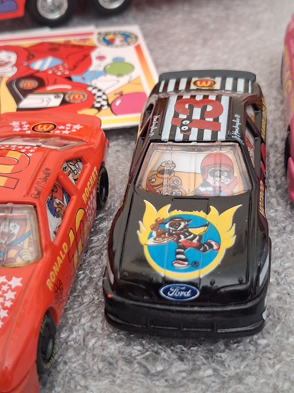 Lot of 1994 McDonaldland Transporter & 7 Car Racing Team set 1-64