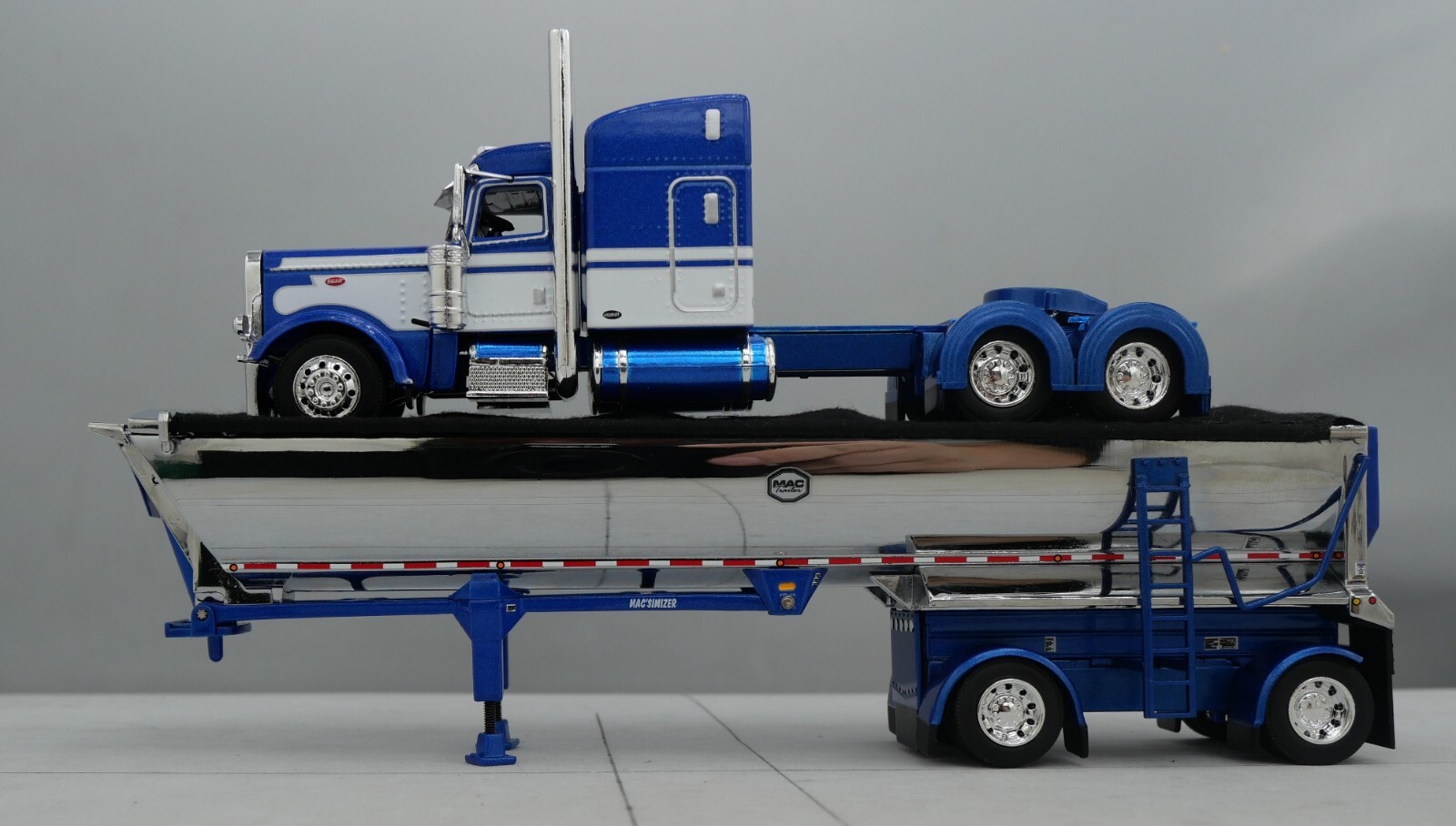 DCP 1/64 Blue White Peterbilt 389 Mac Spread Axle Round Dump Trailer 60-1740