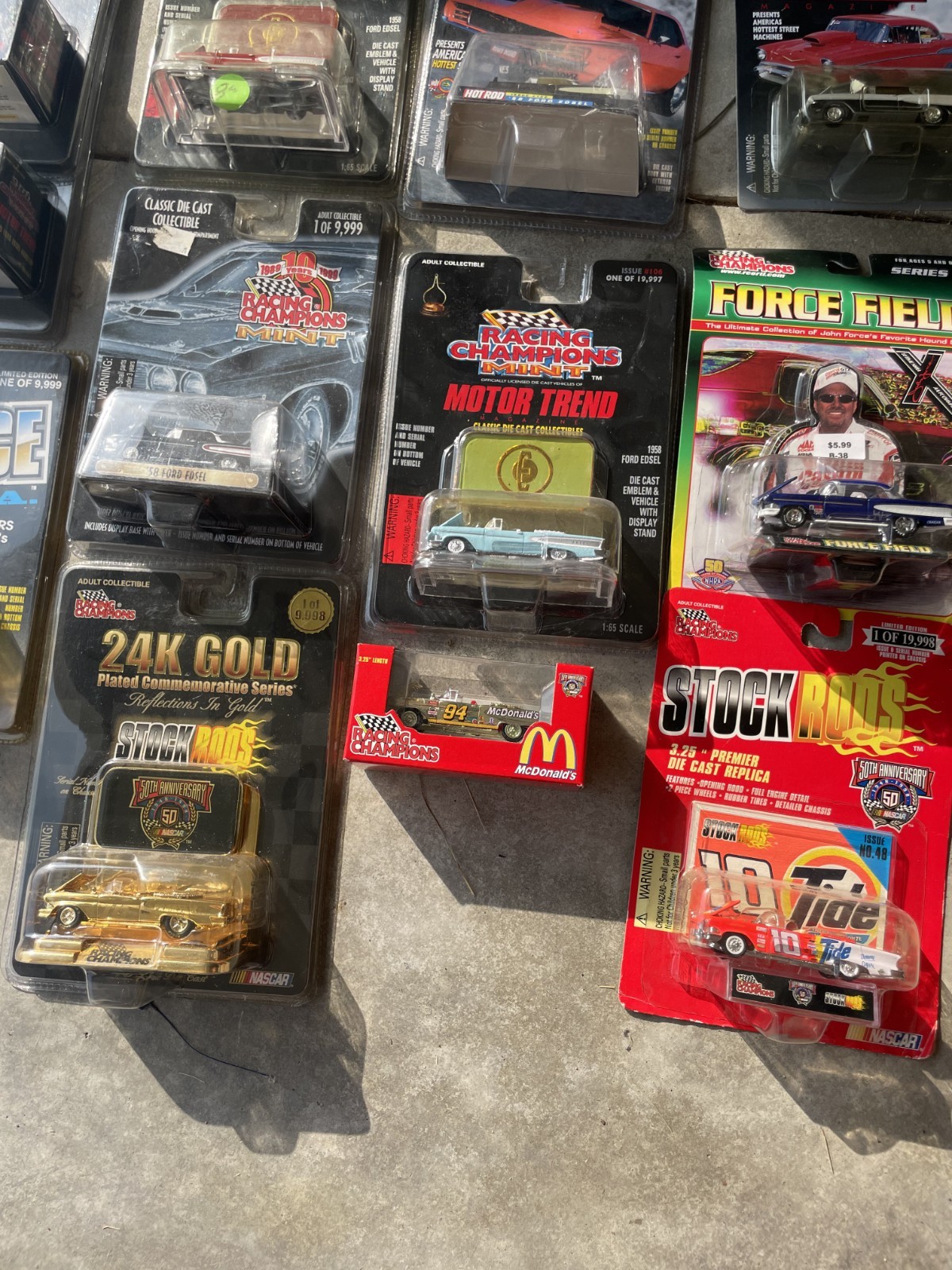 Various brands of 1:64 cars – new in packaging