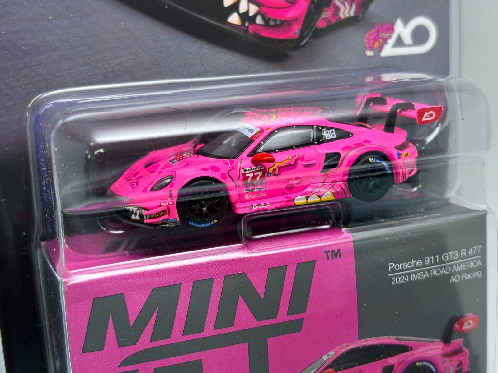 Mini GT 1/64 Porsche 911 GT3 R #77 IMSA Road America Roxy AO Racing #1052 Card