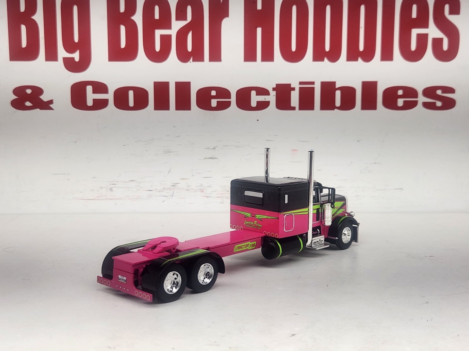 1/64 DCP Loewen Farms Pink, Black 389 Peterbilt With 60″ Flattop Sleeper