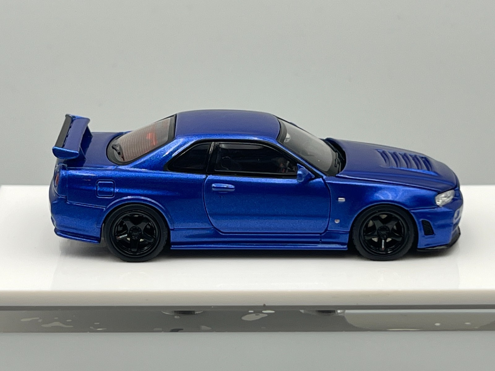 Nissan Skyline NISMO R34 GT-R Z-Tune Bayside Blue MotorHelix 1/64 scale display