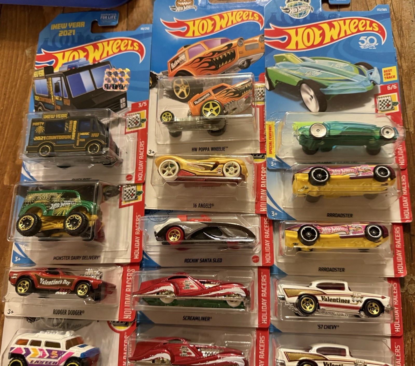 GROUP/LOT OF HOT WHEELS HOLIDAY RACERS! VARIOUS YEARS! 14 TOTAL DIE-CAST CARS!
