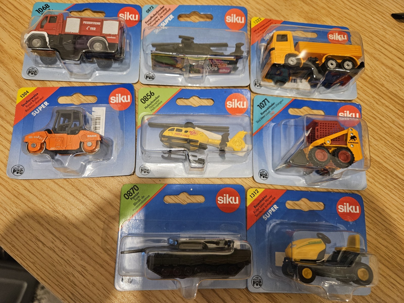 Siku Lot Of 8 Diecast Tank, Lawnmower, Skid Steer, Helicopter. Please Read