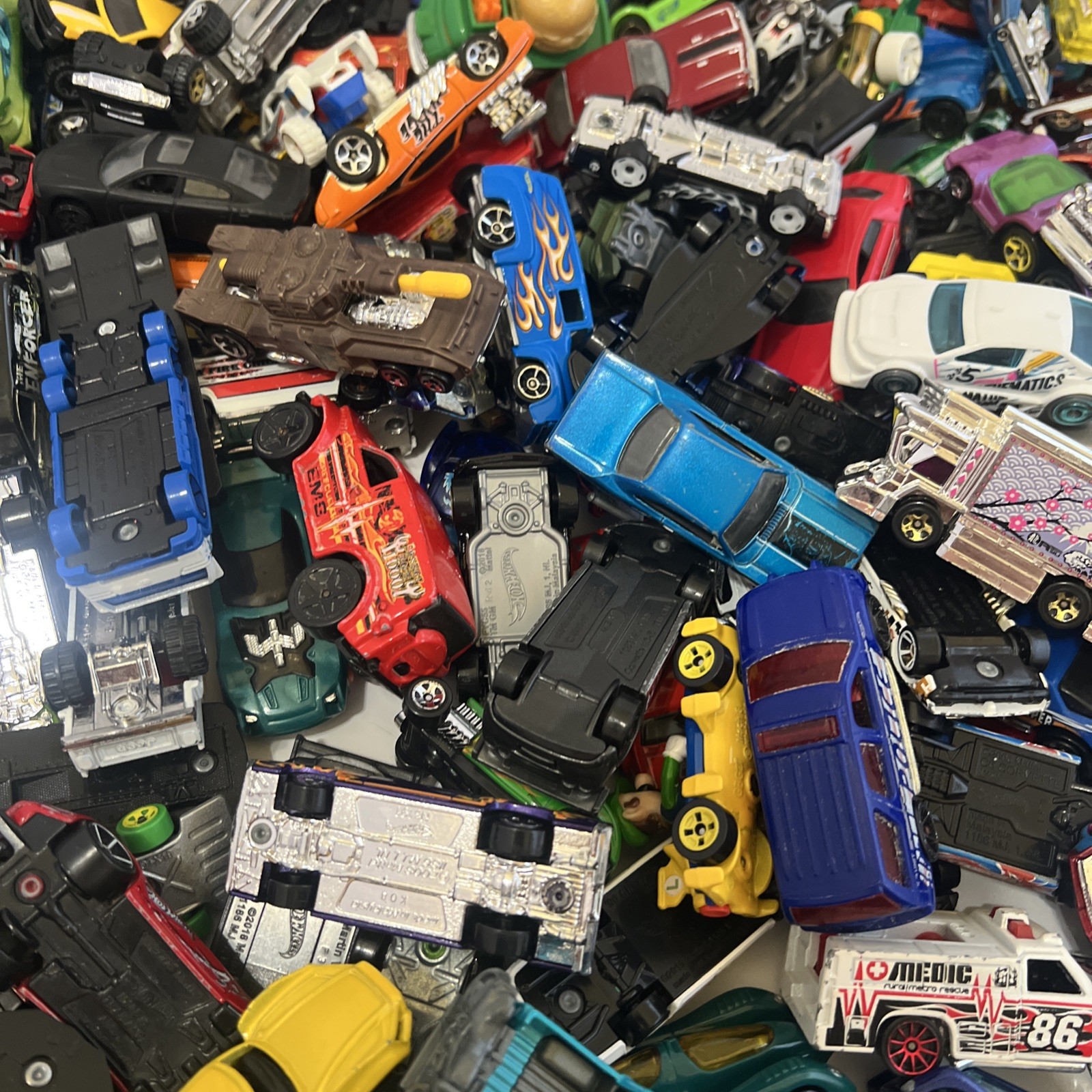30 LBS Pounds of pure hotwheels. There are many different years and castings.