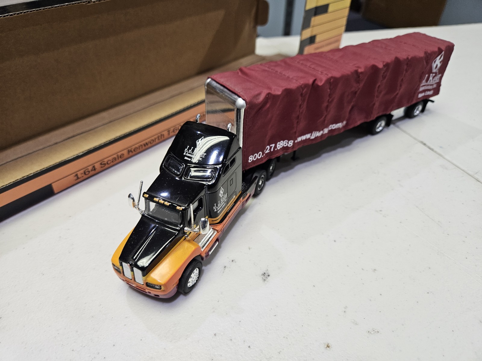 SpecCast J.J. Keller 1:64 Kenworth T-600B w/Conestoga Trailer #830-PP *Details*