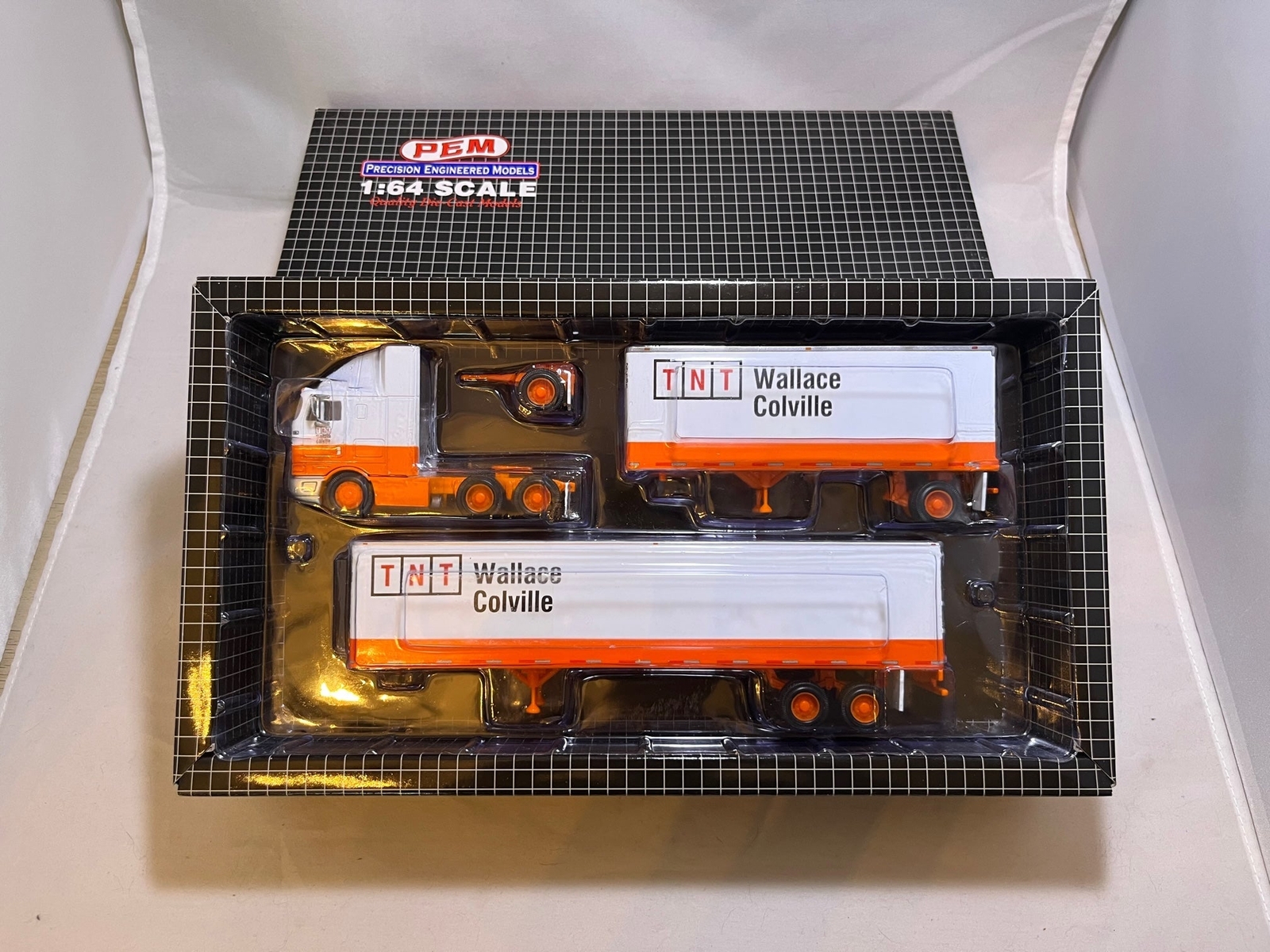 # 01011-B – PEM 1:64 “TNT- Wallace Colville” Hauler – 1 Pc.