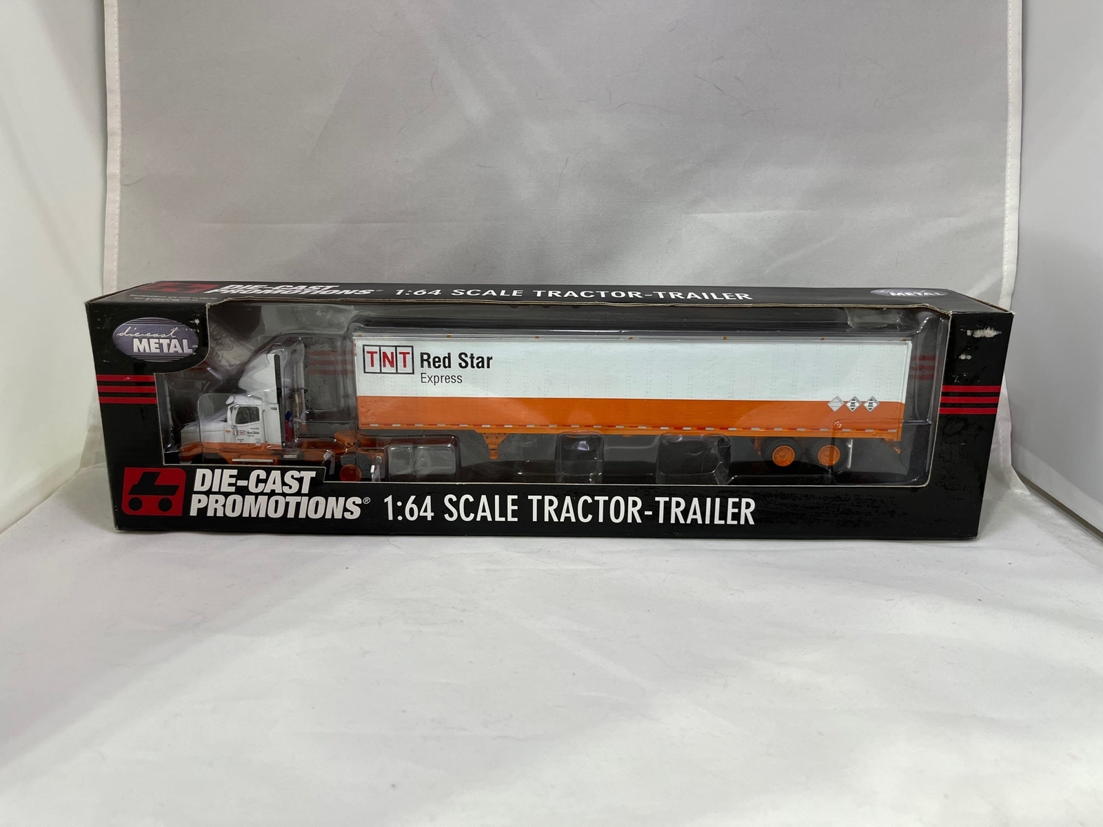# 01003-A – DCP 1:64 “TNT- Red Star Express” Hauler – 1 Pc.