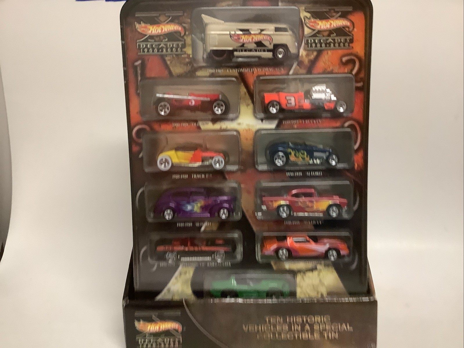 Hot Wheels Decades 1900-2000 Ten Vehicles Cars In Tin with Stand Box