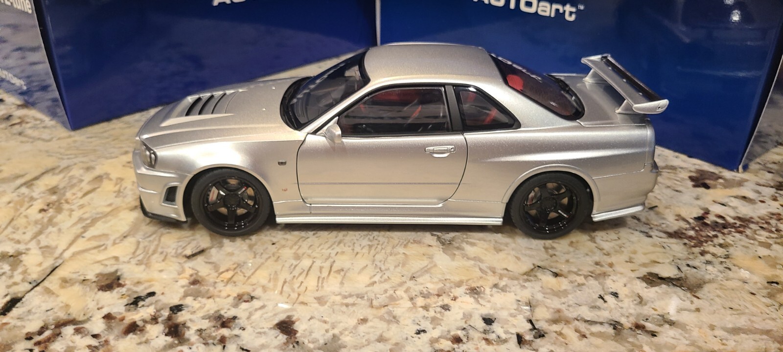 Nissan Skyline GT-R (R34) Z-Tune, Z-Tune Silver in 1:18 scale by AUTOart 77461