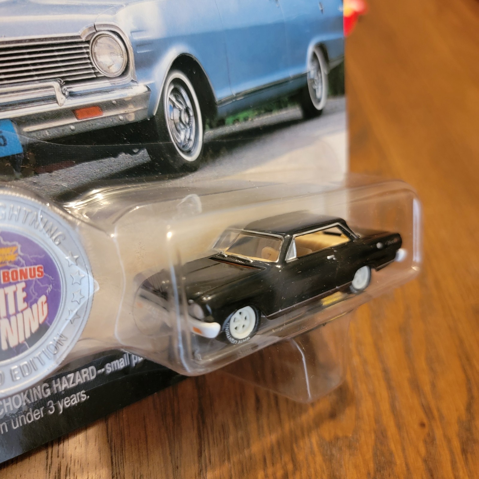 Johnny Lightning 1965 Chevy II Nova Black – 1:64 Diecast White Lighting