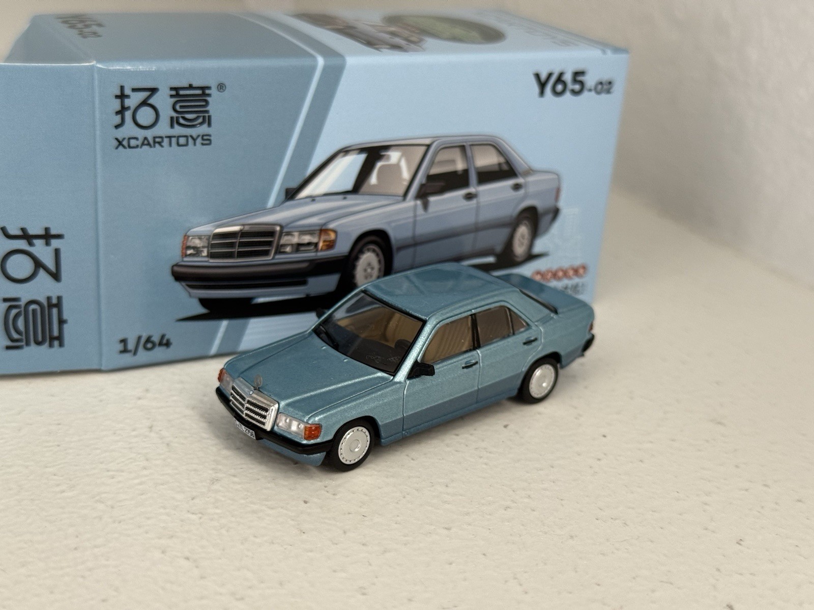 Xcartoys 1:64 diecast Y65-02 Mercedes Benz 190E in light blue 2-tone; Boxed