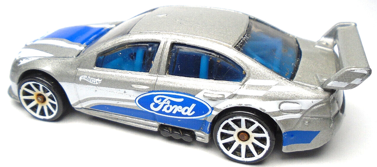 2021 HOT WHEELS FORD FALCON SILVER 1:64 DIECAST 3″ RACE CAR WITH BLUE & WHITE