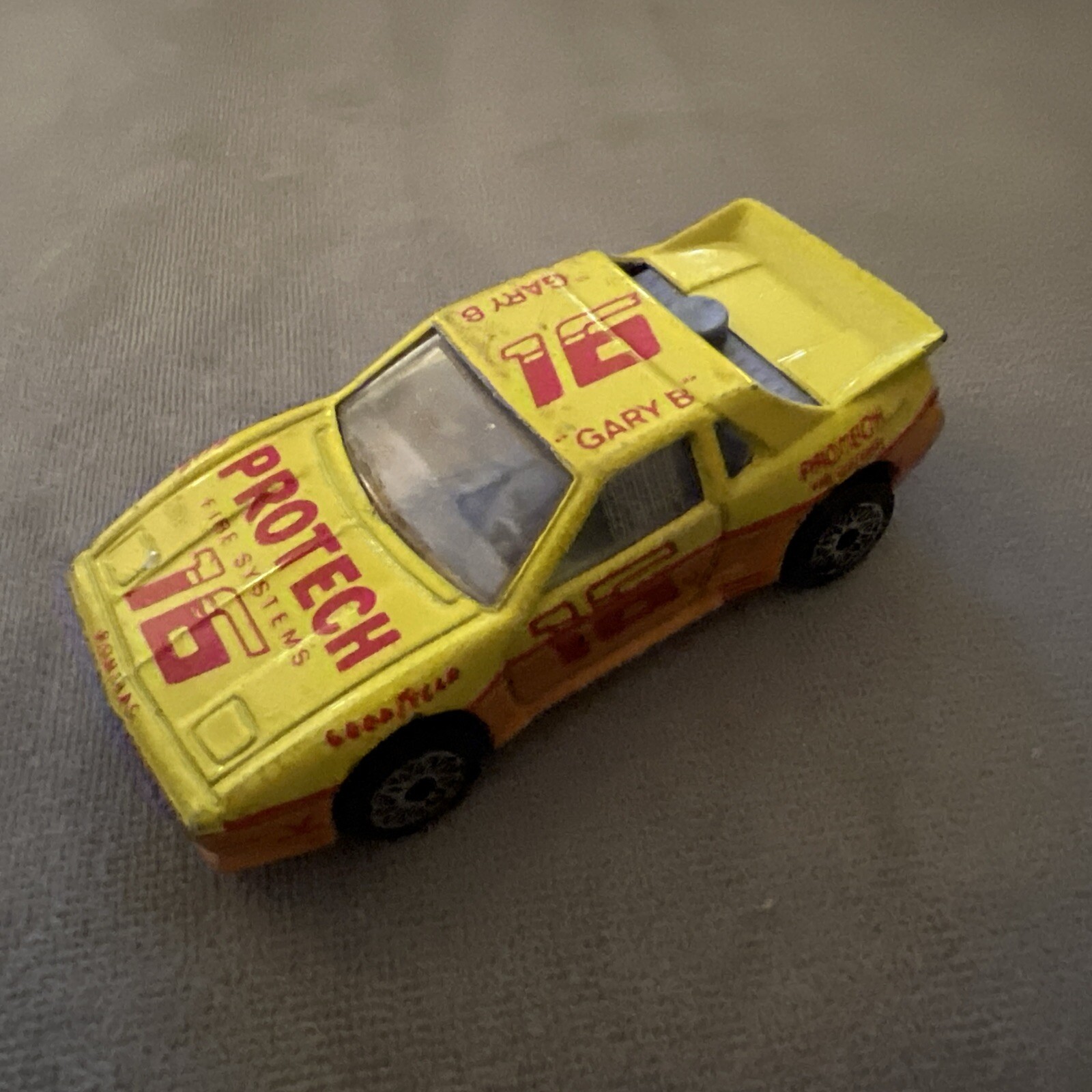 1985 Matchbox SuperFast SF19 Pontiac Fiero #16 ProTech Fire Systems Yellow LOOSE